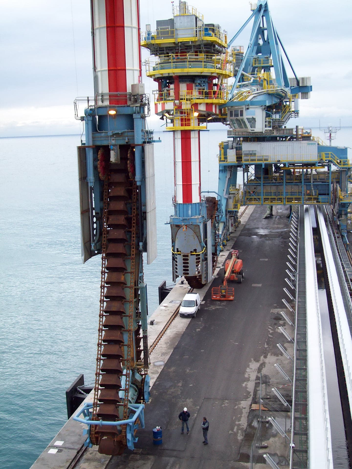 Large port loading equipment on a quay over the sea