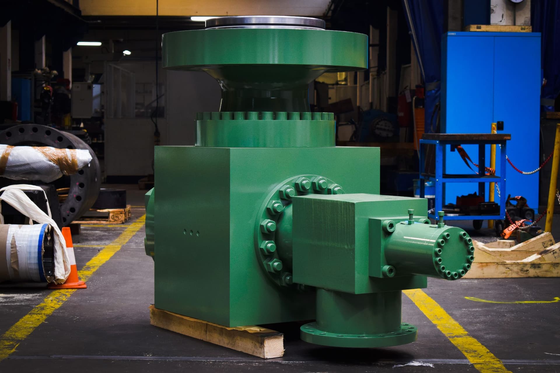 Green prefill valve in the workshop, front view with flanges and pilot cylinder