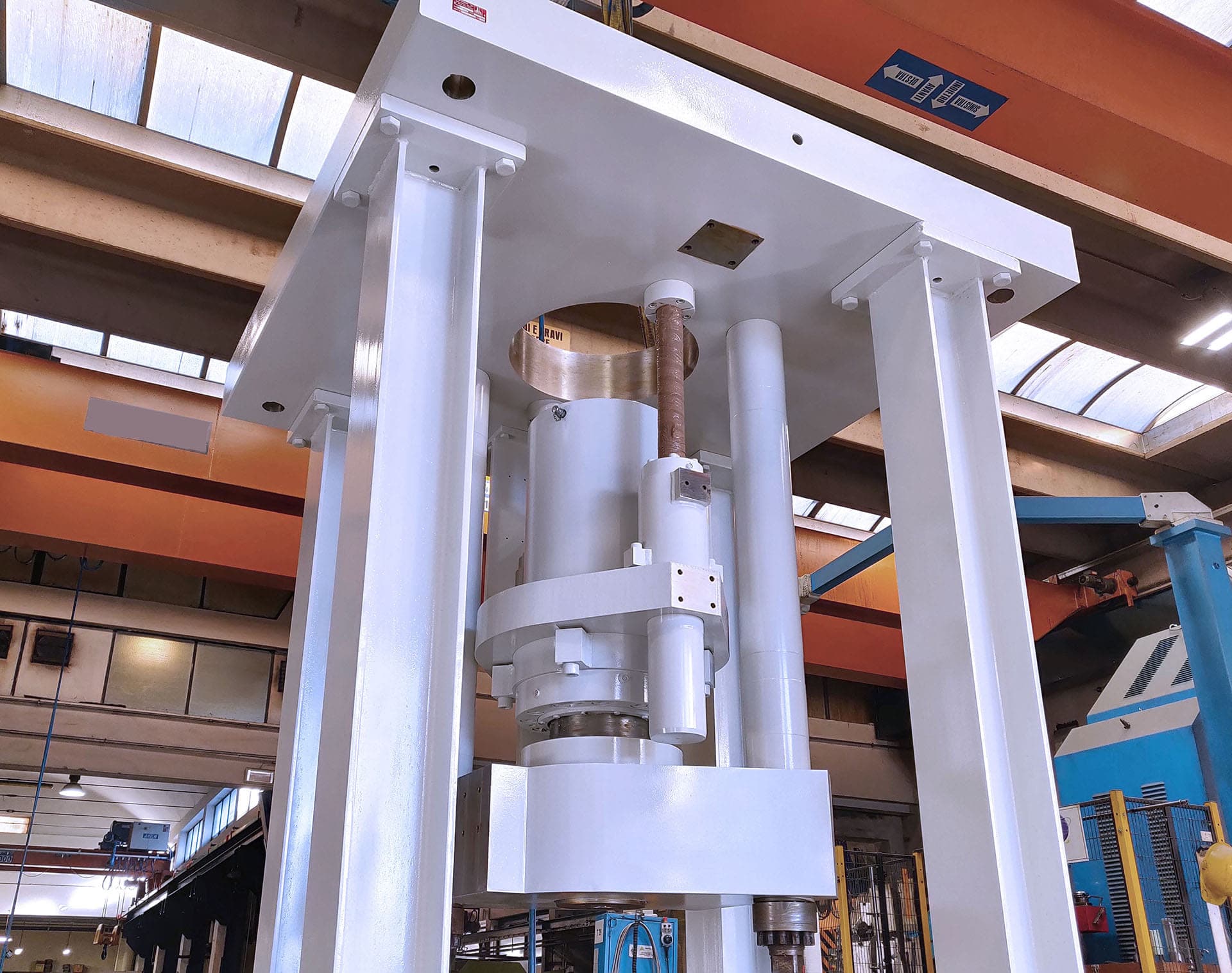 White test frame with a vertical cylinder in a workshop